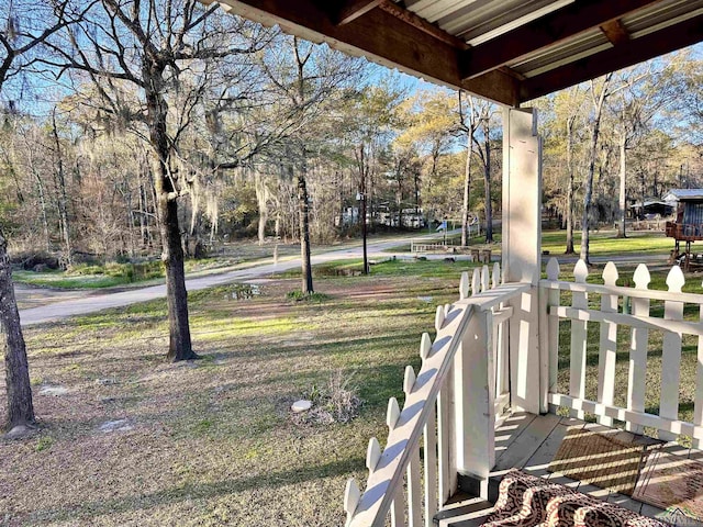 view of yard with covered porch