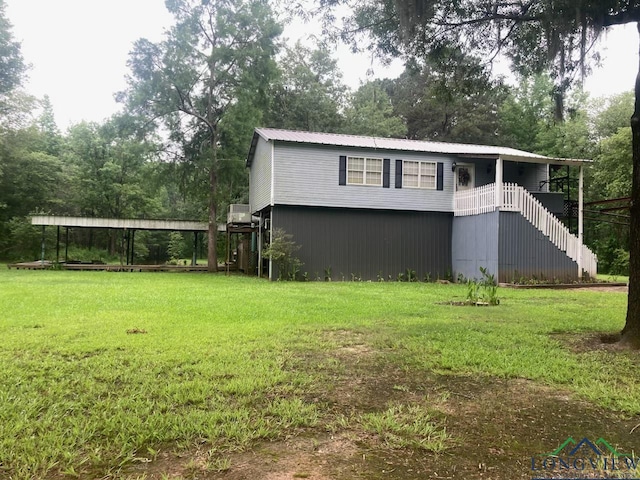 view of side of home featuring a lawn