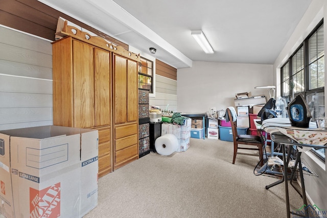 home office featuring light carpet and wooden walls