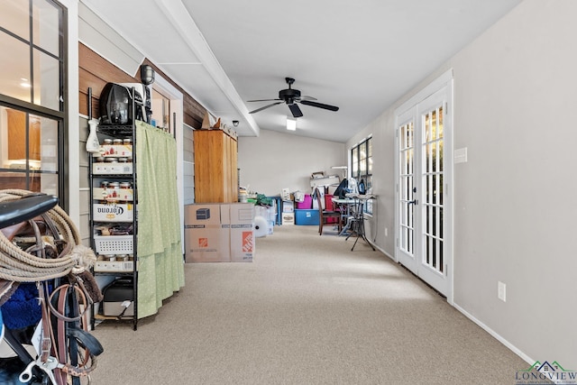 interior space featuring carpet flooring, ceiling fan, lofted ceiling, and french doors