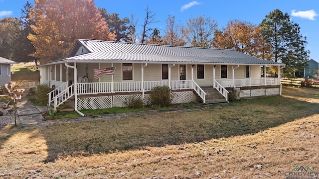 country-style home with a front yard and a porch