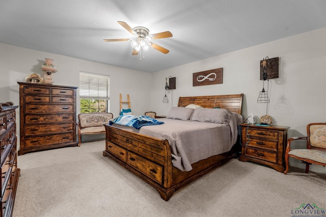 bedroom featuring light colored carpet and ceiling fan