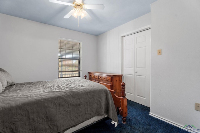 carpeted bedroom featuring ceiling fan and a closet