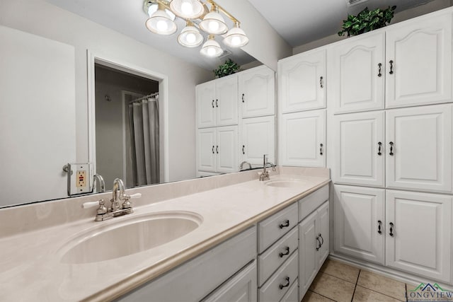 bathroom with vanity and tile patterned floors