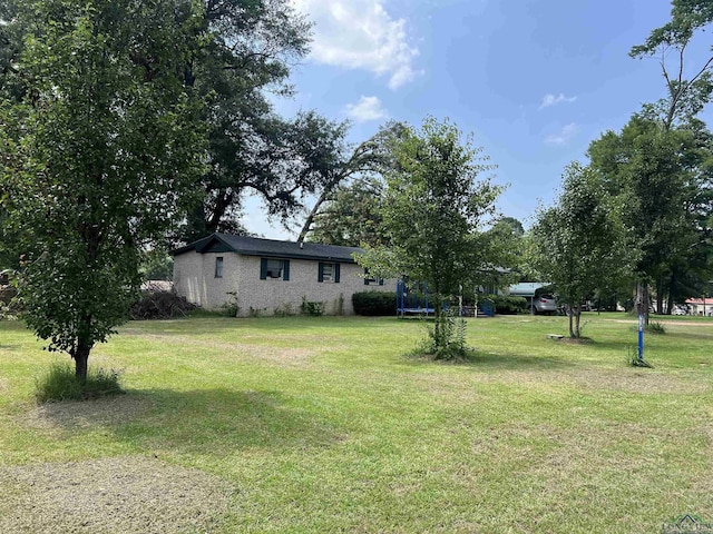 view of yard with a trampoline