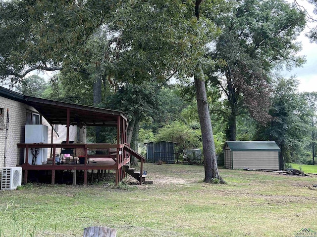 view of yard featuring ac unit and a storage unit