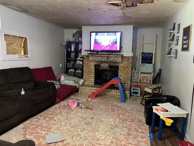 living room featuring a brick fireplace