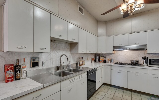 1228 Hillcrest Dr, Longview, TX 75601 - kitchen with under cabinet range hood, a ceiling fan, light countertops, dishwasher, and light tile patterned floors