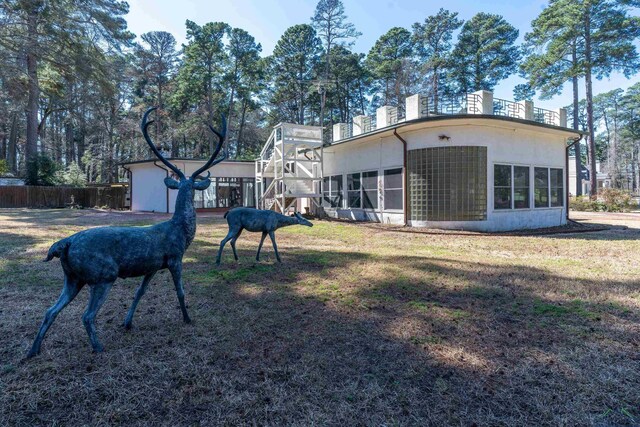 1228 Hillcrest Dr, Longview, TX 75601 - rear view of property with stucco siding