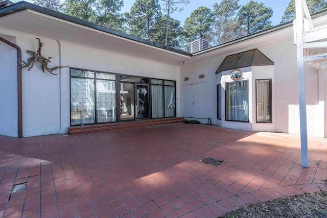 1228 Hillcrest Dr, Longview, TX 75601 - back of house with a patio and stucco siding