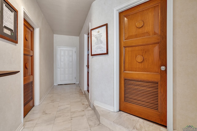 1228 Hillcrest Dr, Longview, TX 75601 - hall featuring light marble finish floors and baseboards