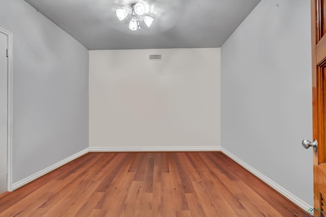 1228 Hillcrest Dr, Longview, TX 75601 - unfurnished room with baseboards and wood finished floors