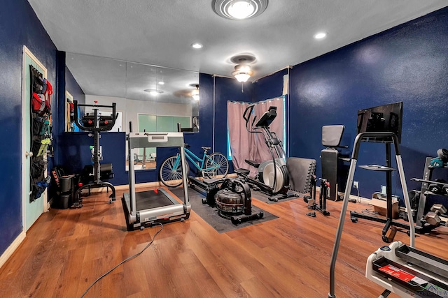 1228 Hillcrest Dr, Longview, TX 75601 - workout area with wood finished floors and recessed lighting