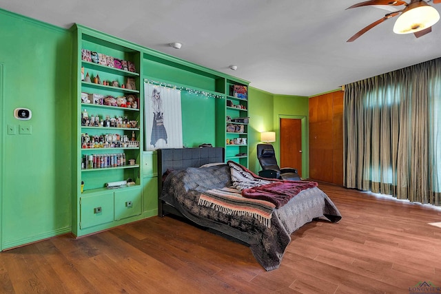 1228 Hillcrest Dr, Longview, TX 75601 - bedroom featuring wood finished floors and ceiling fan