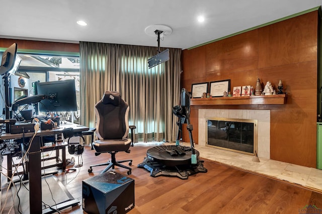1228 Hillcrest Dr, Longview, TX 75601 - living room with wood finished floors, a tiled fireplace, and recessed lighting