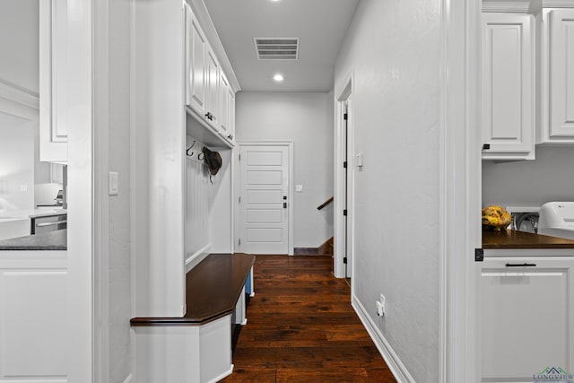 hall with dark hardwood / wood-style flooring