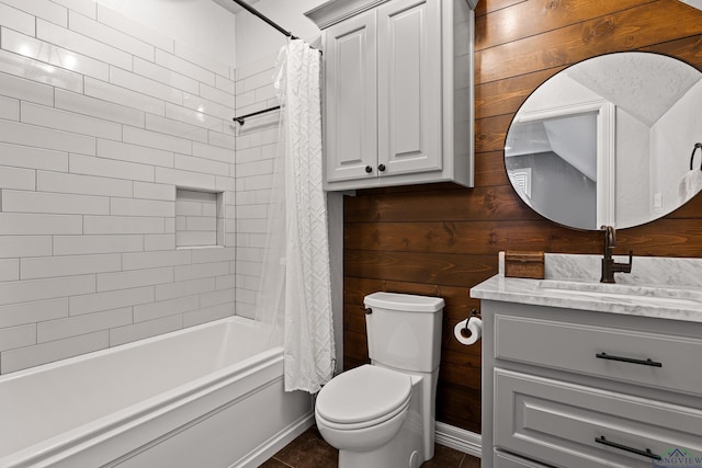 full bathroom with toilet, vanity, shower / bath combo, and wood walls