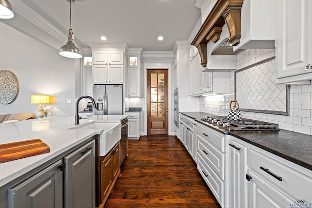 kitchen featuring sink, stainless steel appliances, and white cabinets