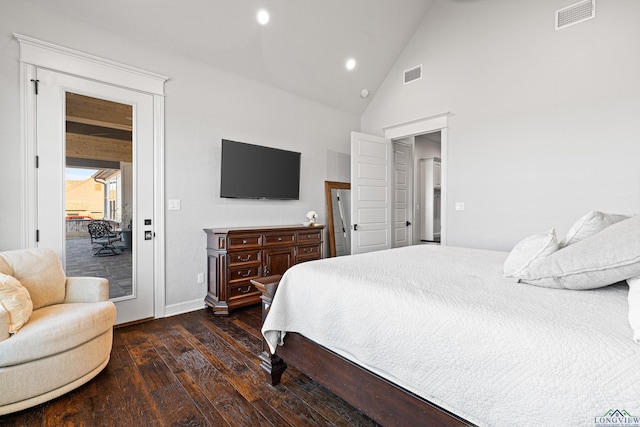 bedroom featuring dark hardwood / wood-style flooring, access to exterior, and high vaulted ceiling