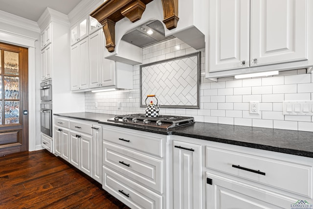 kitchen featuring stainless steel appliances, dark wood-type flooring, exhaust hood, and white cabinets