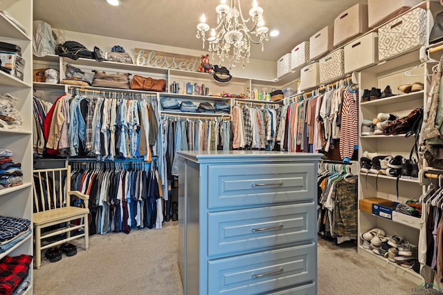 walk in closet with light carpet and an inviting chandelier