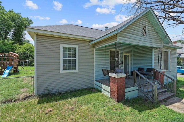 1105 N Bolivar, Marshall, TX 75670 - rear view of house with a shingled roof
