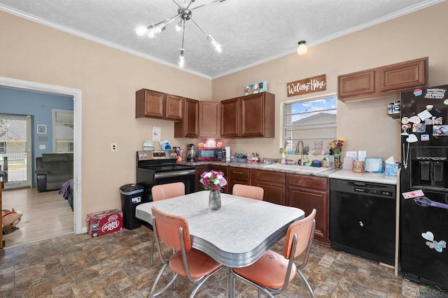 1105 N Bolivar, Marshall, TX 75670 - kitchen featuring black appliances, a chandelier, stone finish floors, light countertops, and a textured ceiling