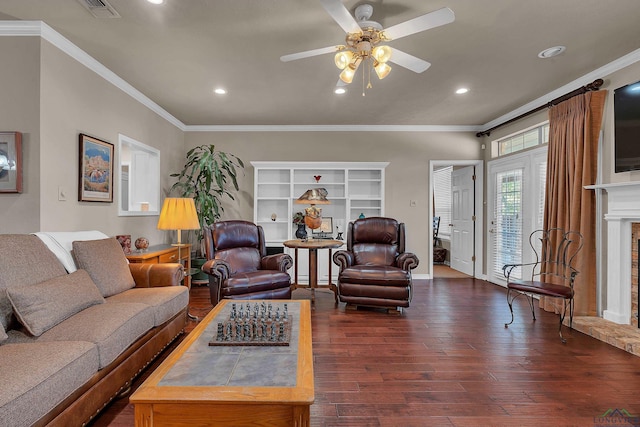 living room featuring crown molding, ceiling fan, and dark wood-type flooring