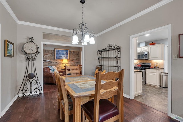 dining area with dark hardwood / wood-style flooring, a chandelier, and ornamental molding