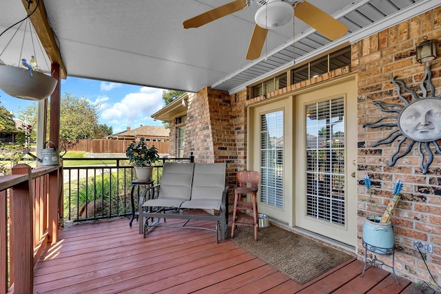 wooden terrace featuring ceiling fan