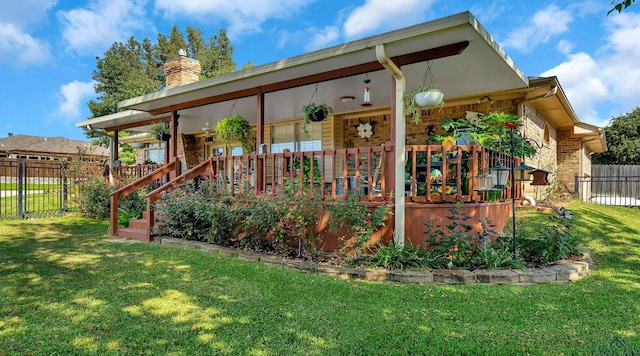 back of property featuring a porch and a lawn