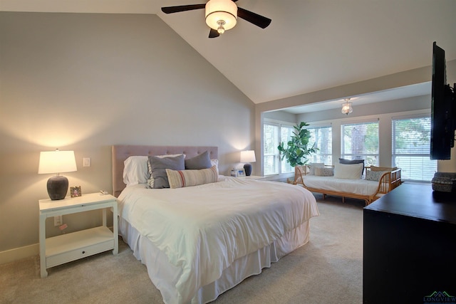 bedroom with ceiling fan, light colored carpet, and high vaulted ceiling