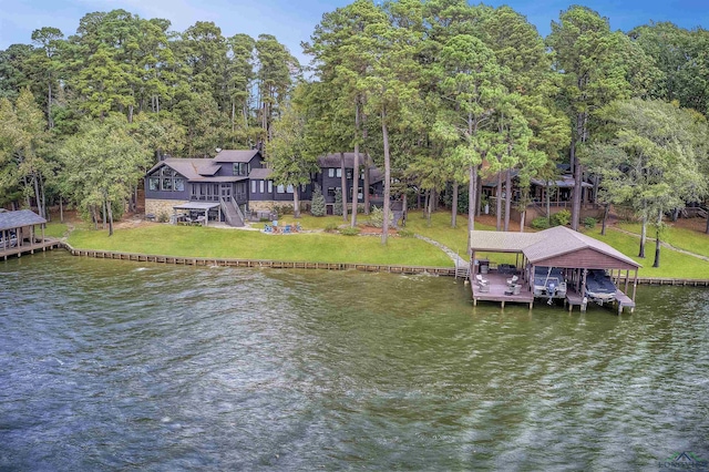 dock area featuring a yard and a water view