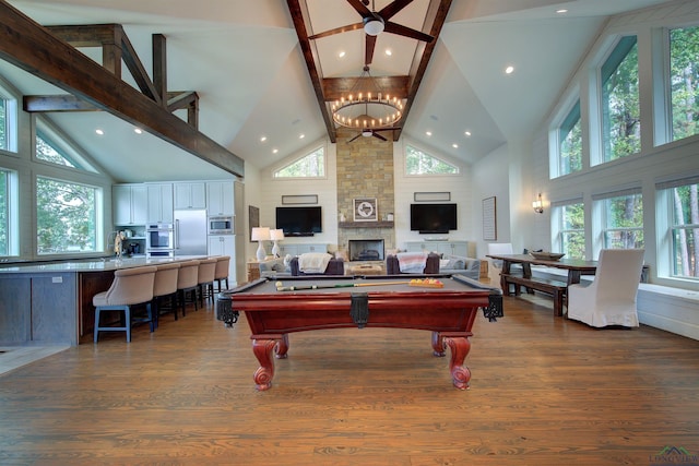 game room with high vaulted ceiling, billiards, a fireplace, beam ceiling, and dark hardwood / wood-style flooring