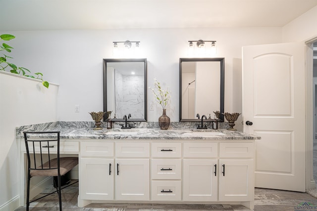 bathroom featuring hardwood / wood-style floors and vanity