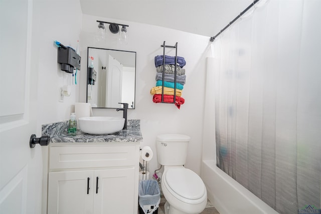 full bathroom featuring vanity, shower / tub combo, and toilet