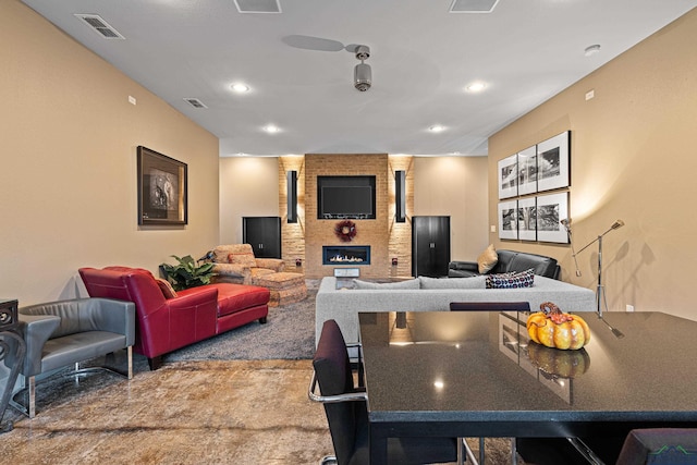 kitchen with a large fireplace and carpet