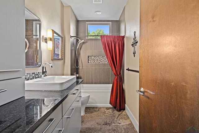 full bathroom with shower / tub combo, vanity, and toilet