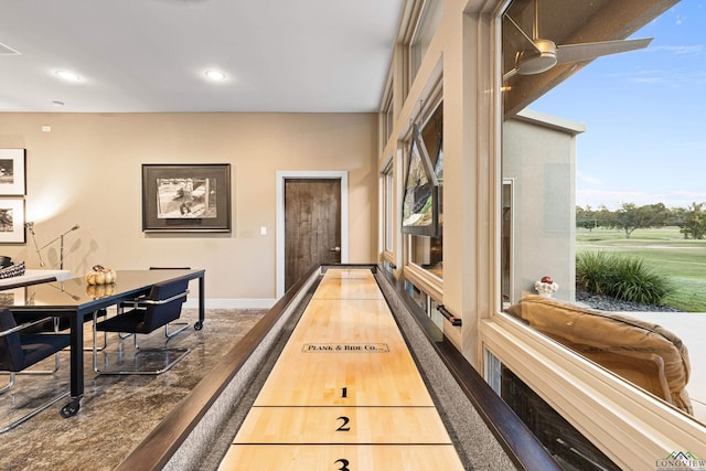 playroom with hardwood / wood-style floors and ceiling fan