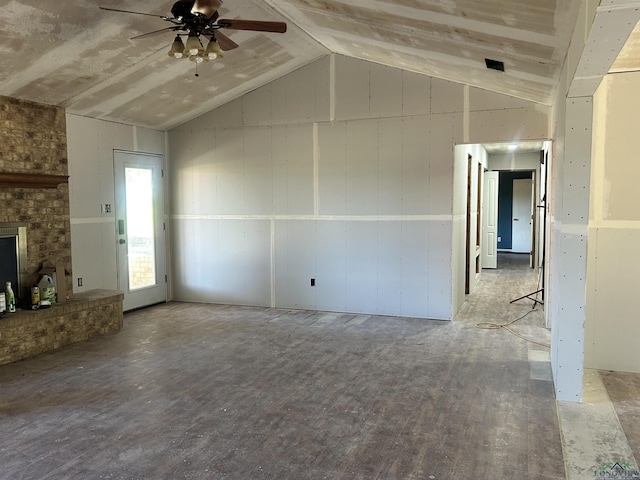 unfurnished living room featuring hardwood / wood-style flooring, ceiling fan, and lofted ceiling