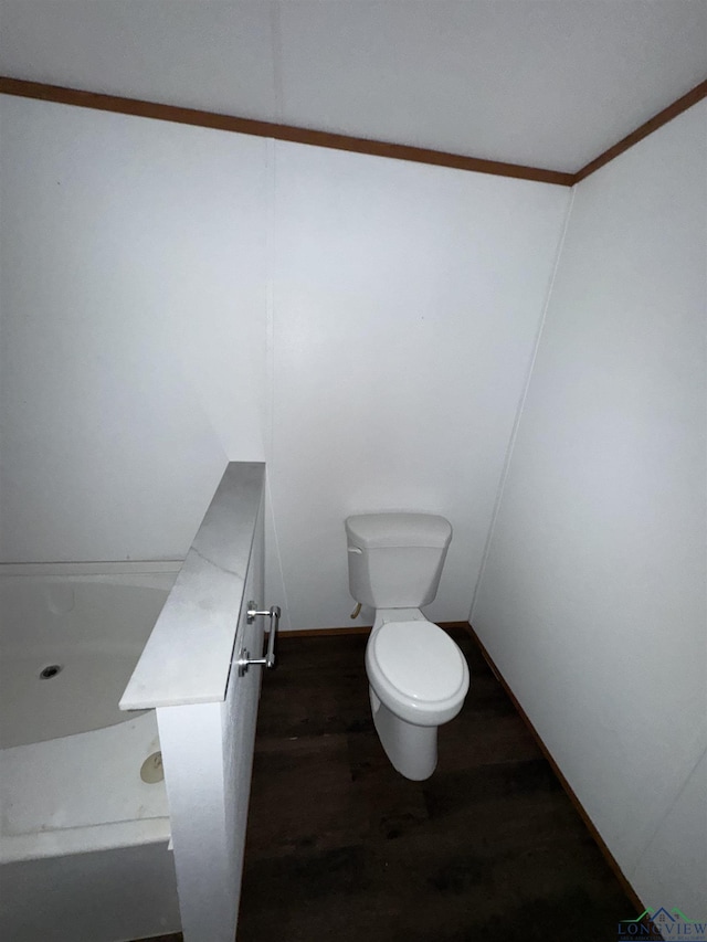 12700 2184 D, Tatum, TX 75691 - bathroom featuring toilet and wood finished floors