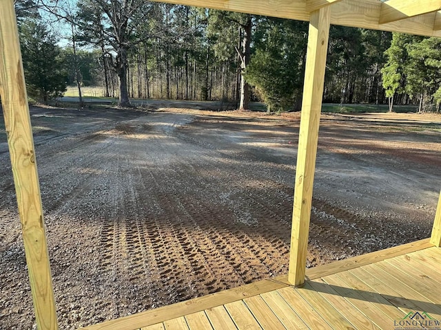 12700 2184 D, Tatum, TX 75691 - wooden terrace featuring view of scattered trees