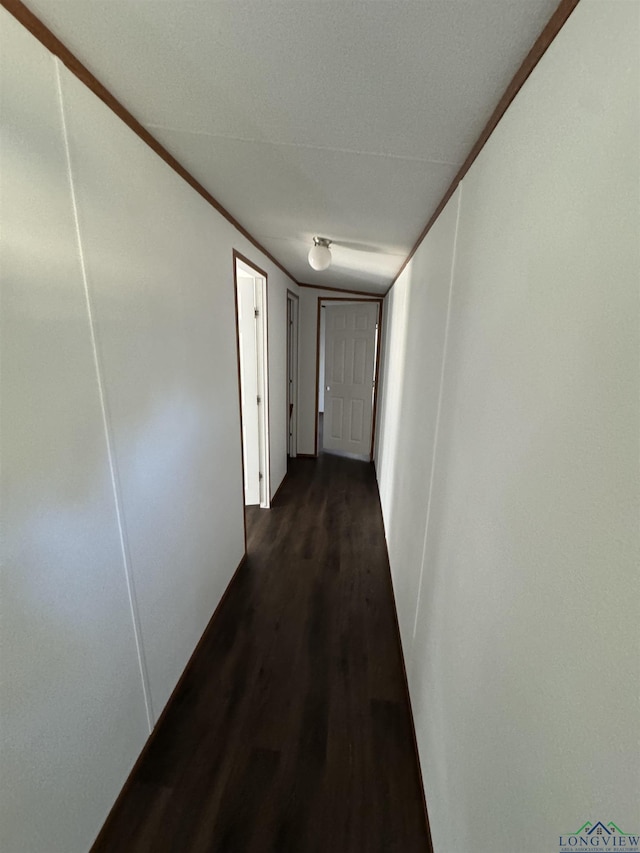 12700 2184 D, Tatum, TX 75691 - corridor with dark wood-style flooring and baseboards