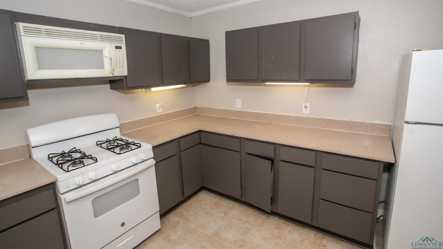 kitchen with gray cabinets, white appliances, and crown molding