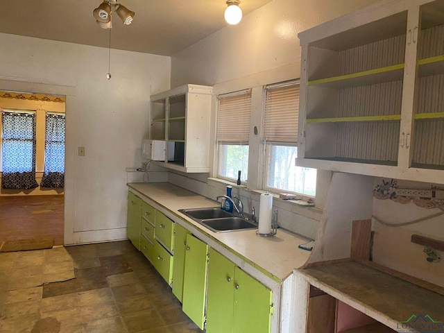 kitchen featuring sink and green cabinetry