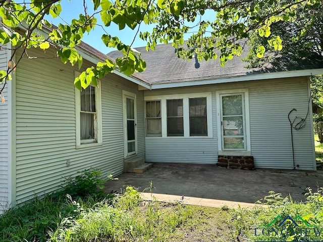 rear view of property with a patio area