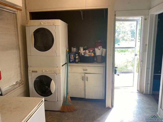 clothes washing area with stacked washer / drying machine