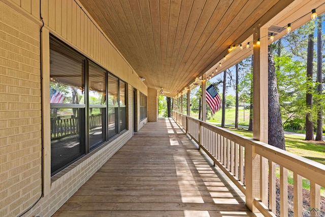 wooden terrace with a porch