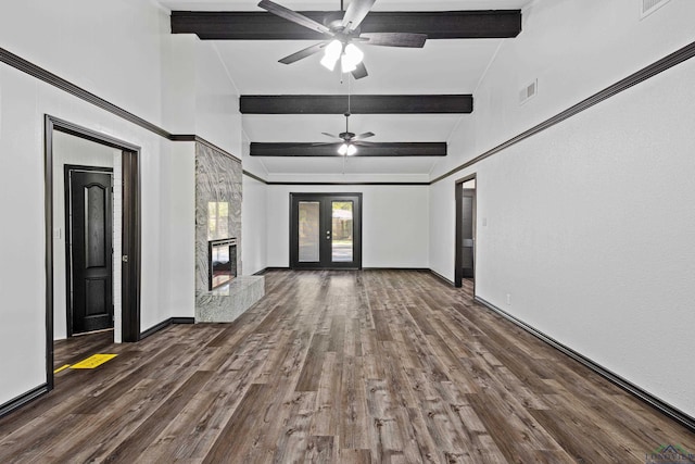 unfurnished living room featuring lofted ceiling with beams, ceiling fan, and dark wood-type flooring