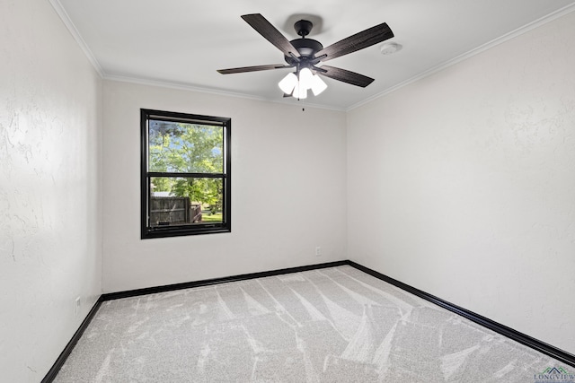 unfurnished room featuring carpet, ceiling fan, and ornamental molding